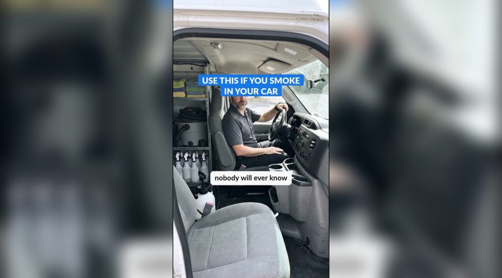 An AI-made detailer character sitting in the driver's seat of a work van with cleaning supplies on the shelves behind him